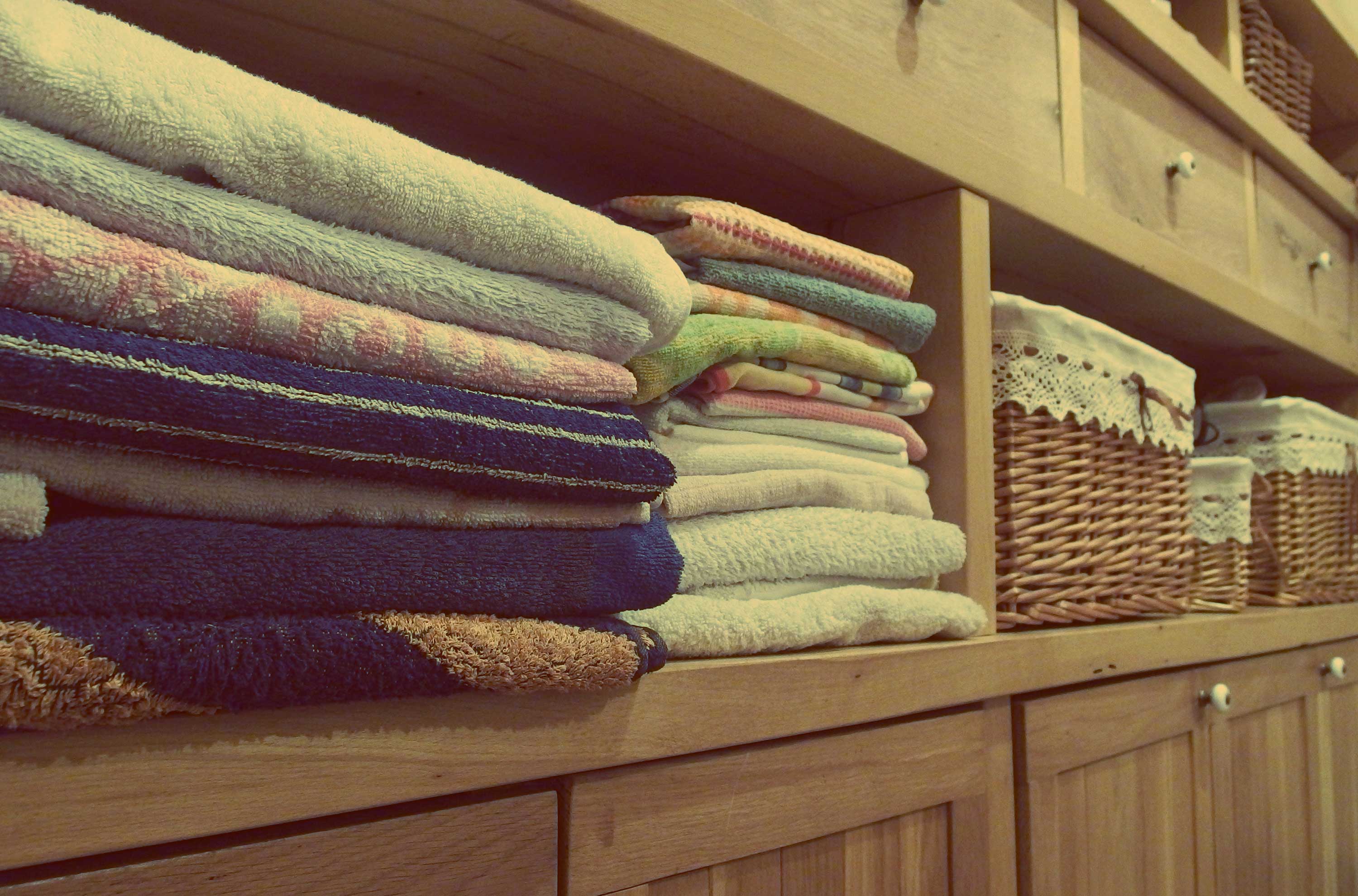 Sell your home -neatly folded towels and baskets
