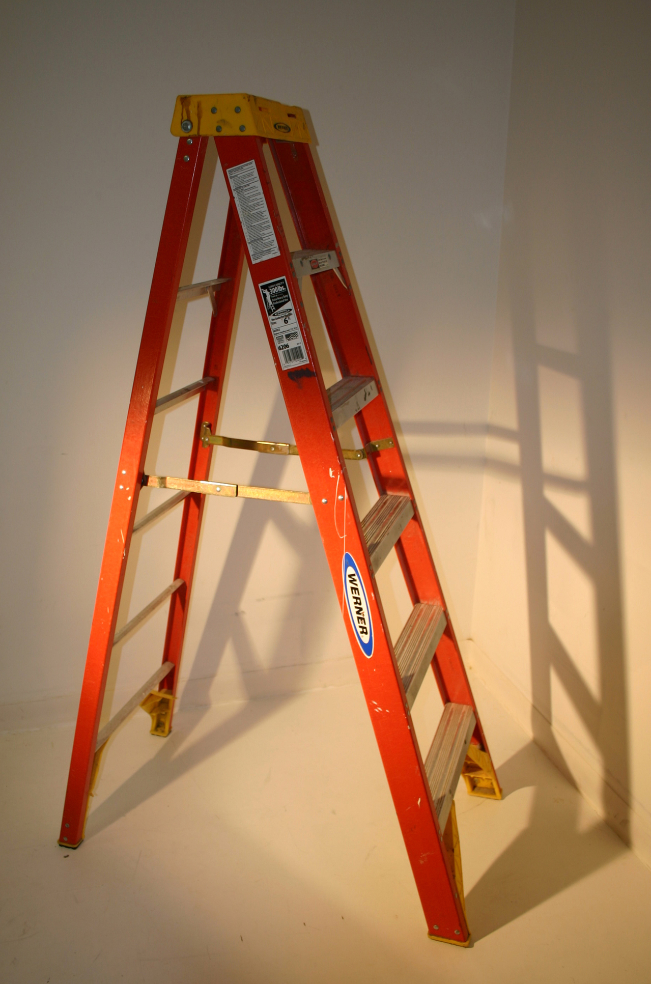 First time home buyer Red ladder with shadow in background